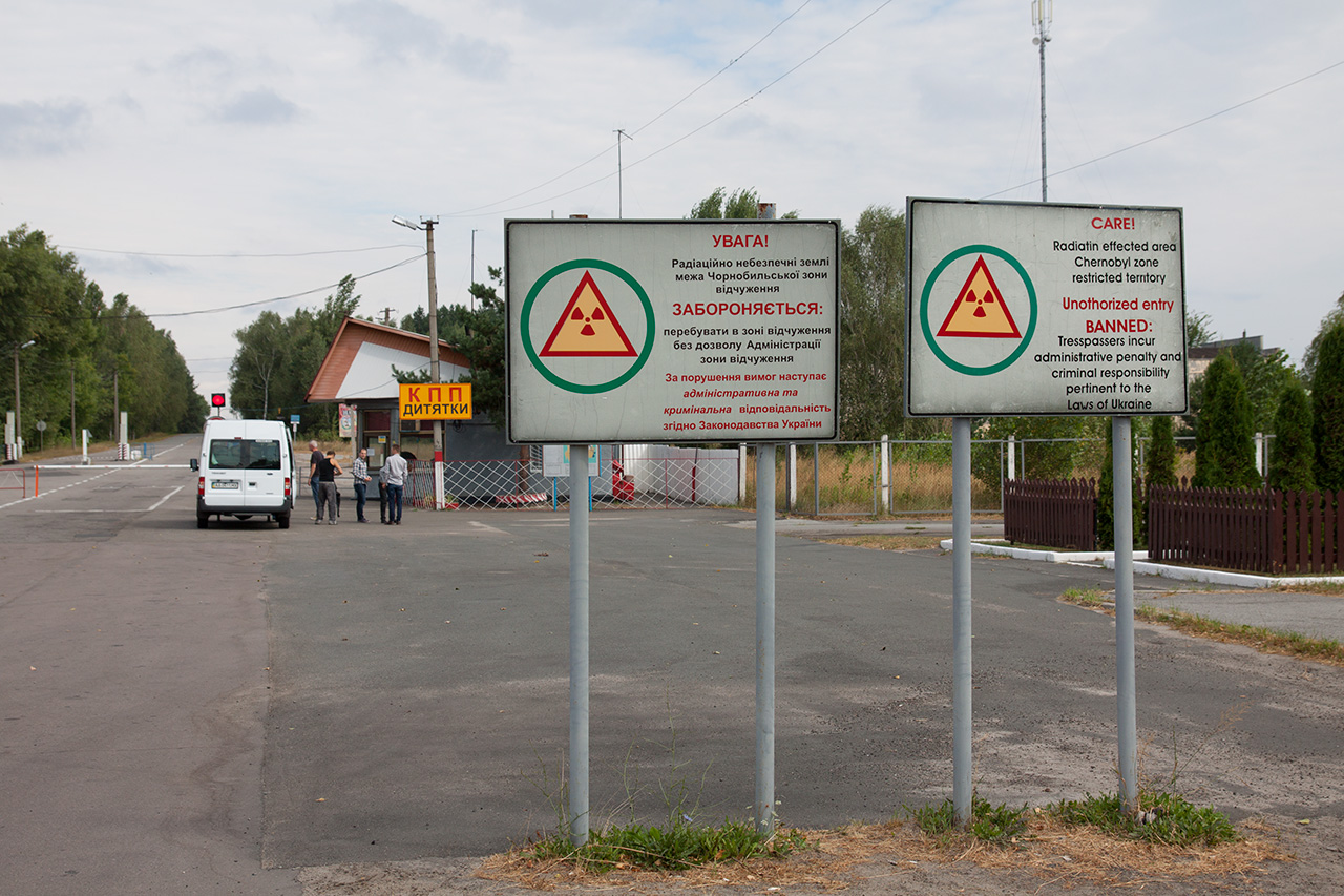 Warning signs at the checkpoint entrance to the Chernobyl exclusion zone