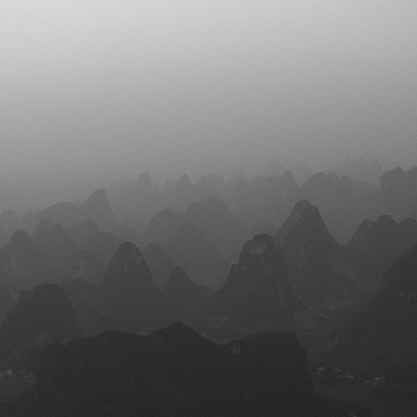 Misty karst mountains layered in fog, Guilin