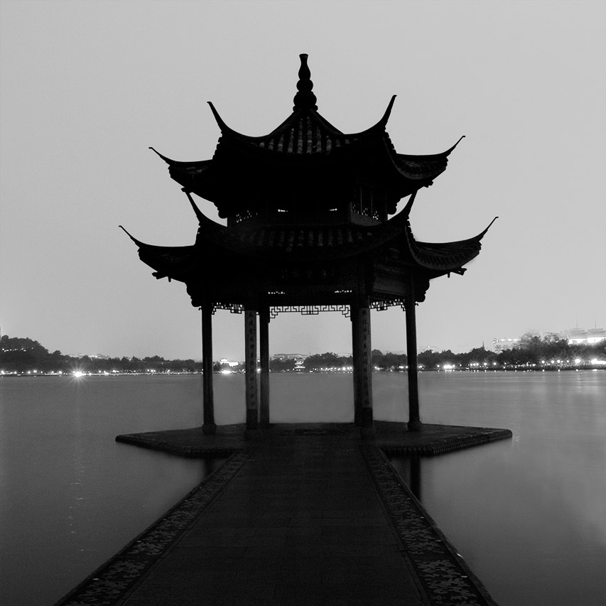 Silhouette of Jixian Pavilion at dusk on West Lake, Hangzhou