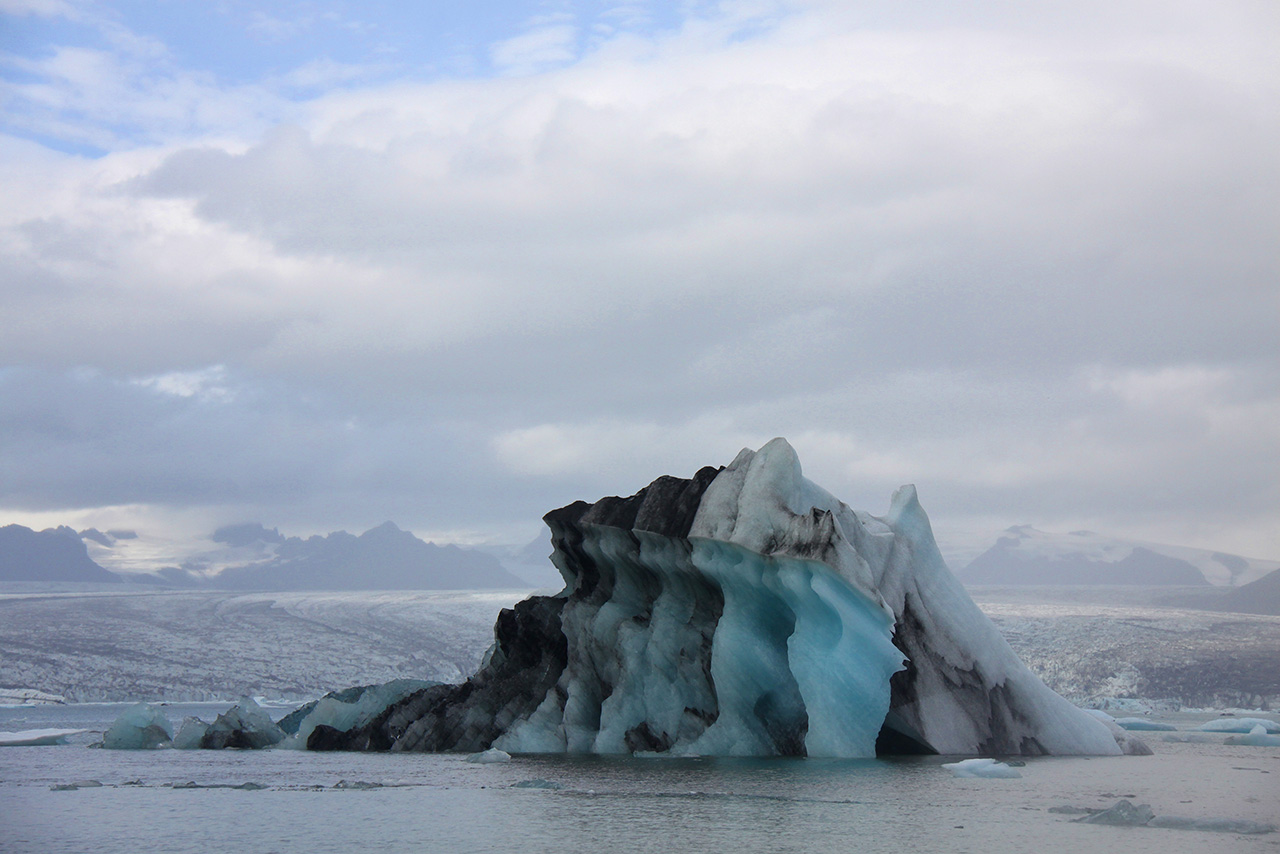 Striped iceberg with black ash layers in Iceland