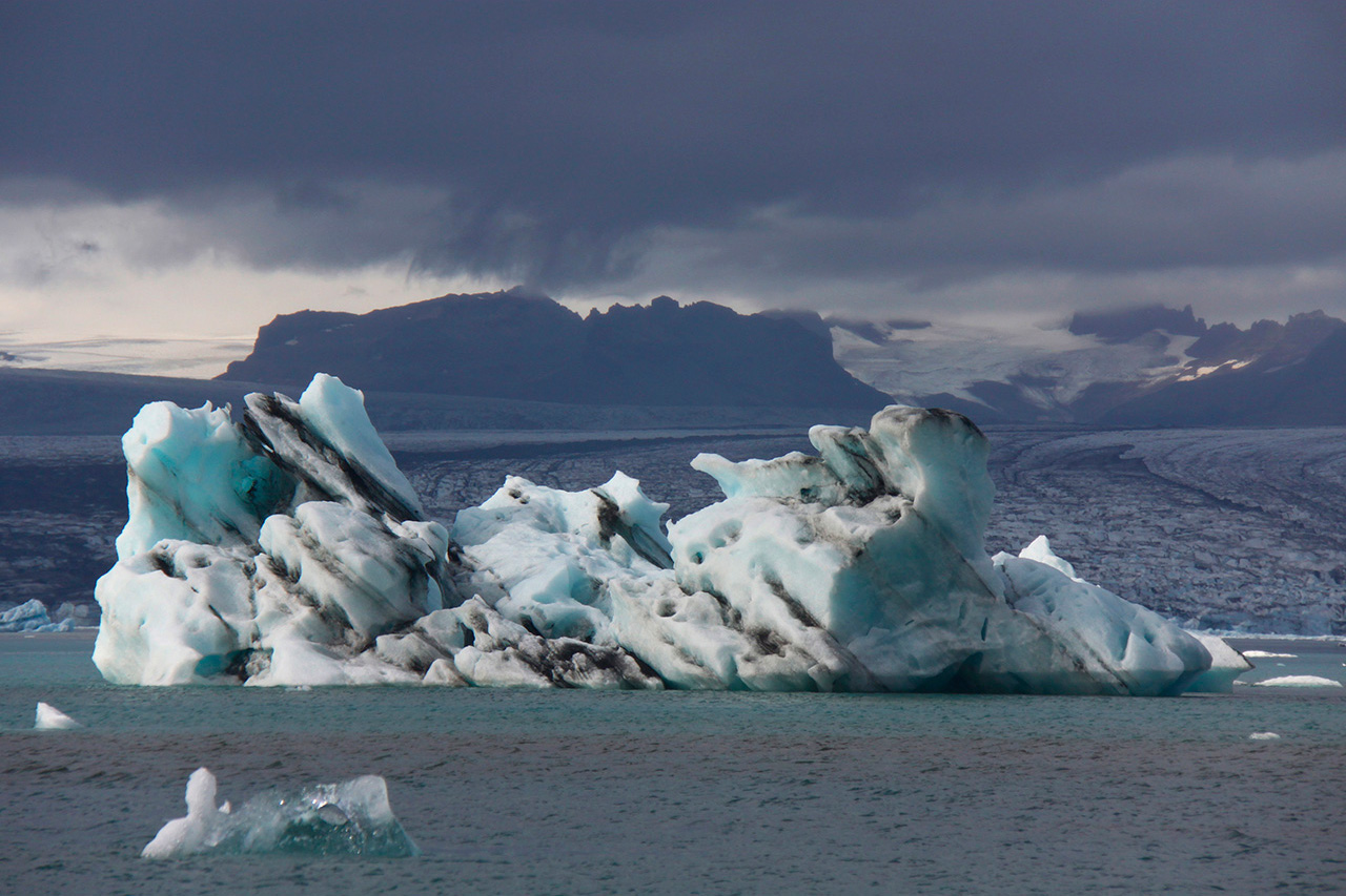 Dramatic iceberg under dark stormy sky in Iceland
