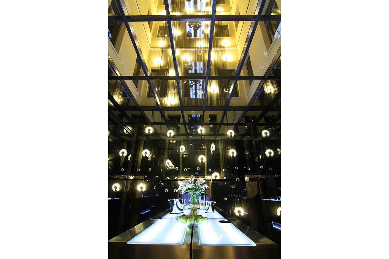 Hotel Radisson Blu Madrid Prado atrium with hanging lights