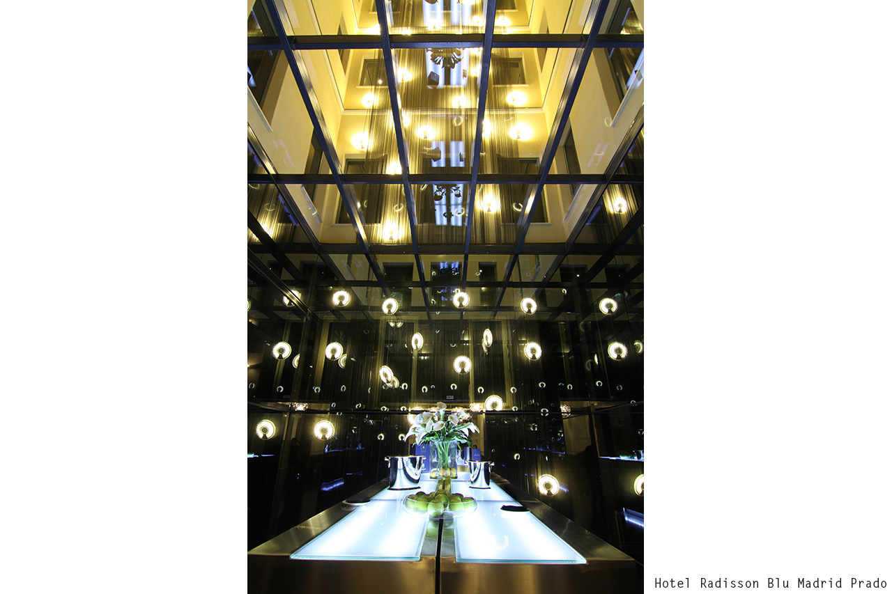Hotel Radisson Blu Madrid Prado atrium with hanging lights