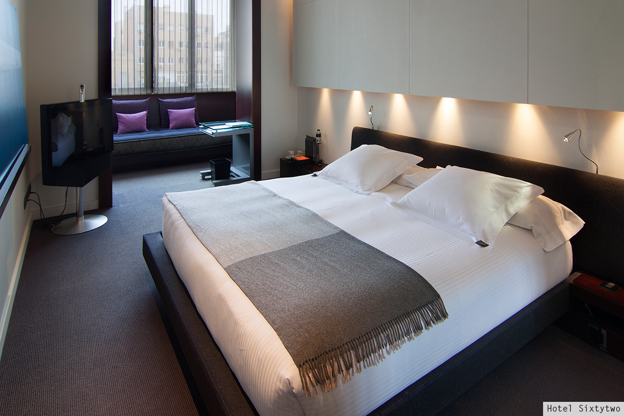 Hotel Sixtytwo bedroom with purple cushions and window seat