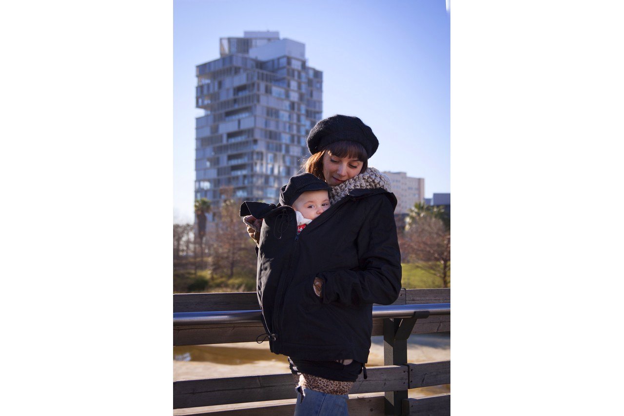 Mother with baby in a carrier jacket, Barcelona