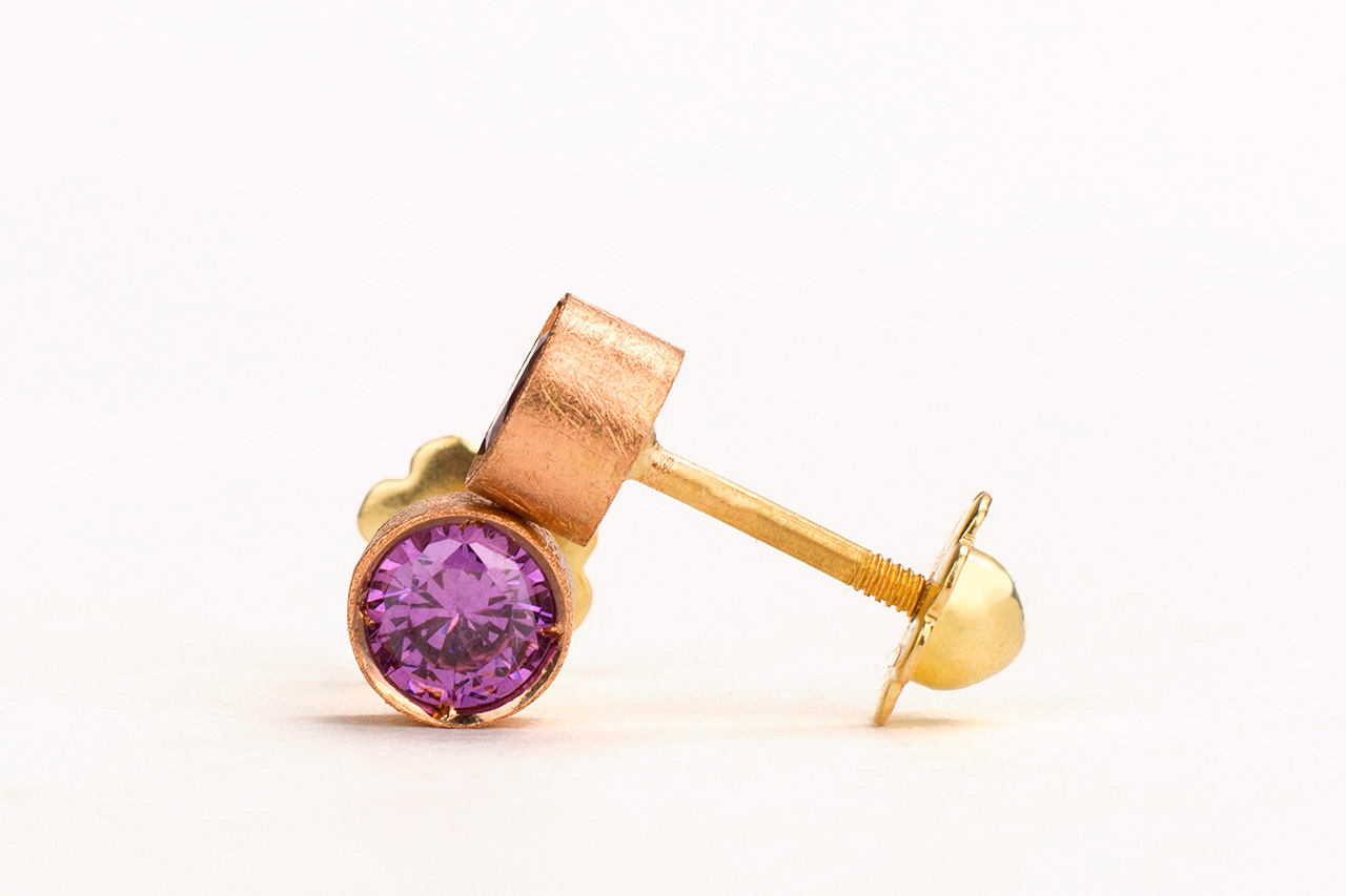 Rose gold earring with purple gemstone