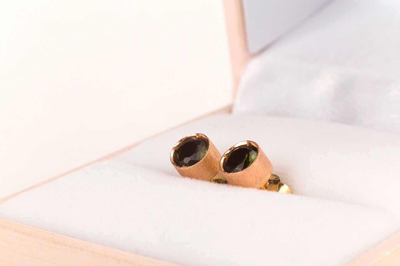 Rose gold earrings with dark gemstones