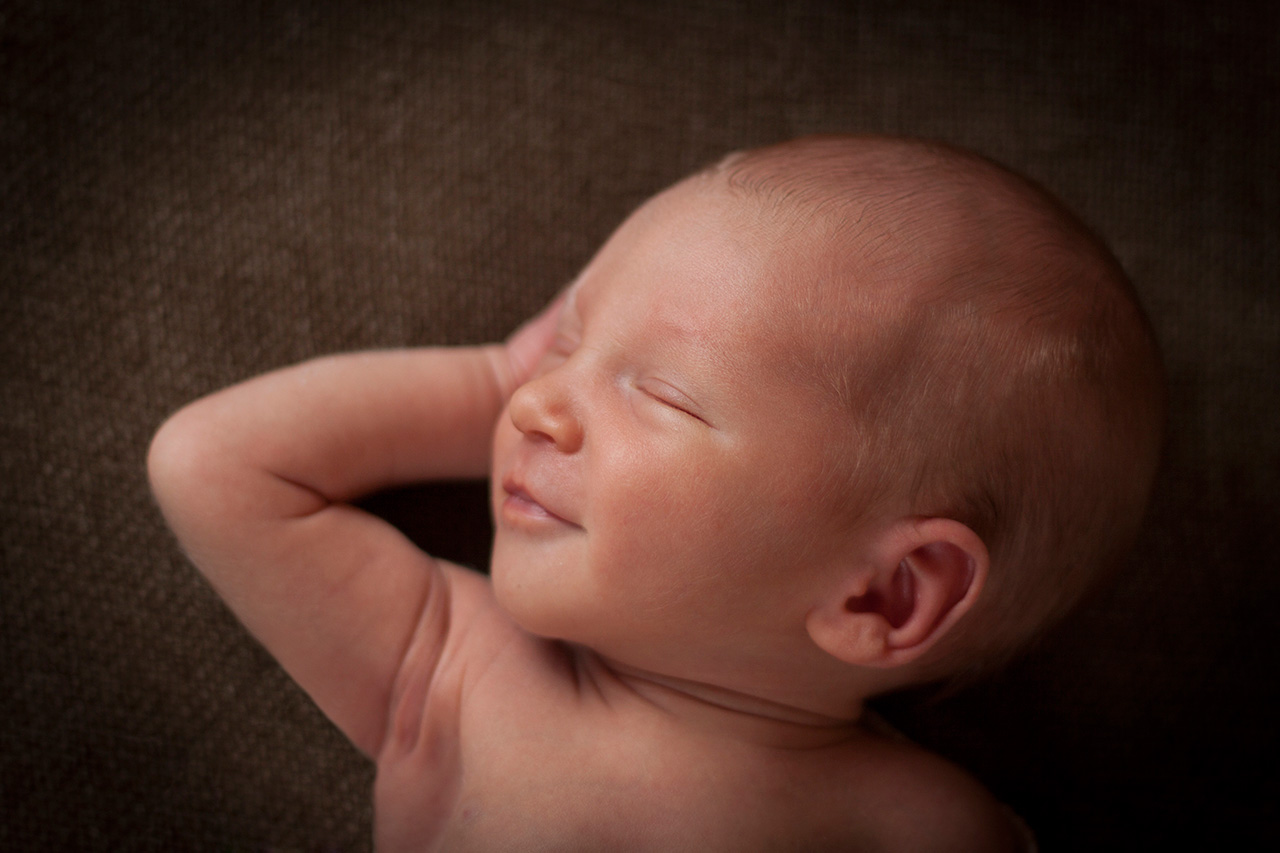 Newborn baby sleeping studio portrait