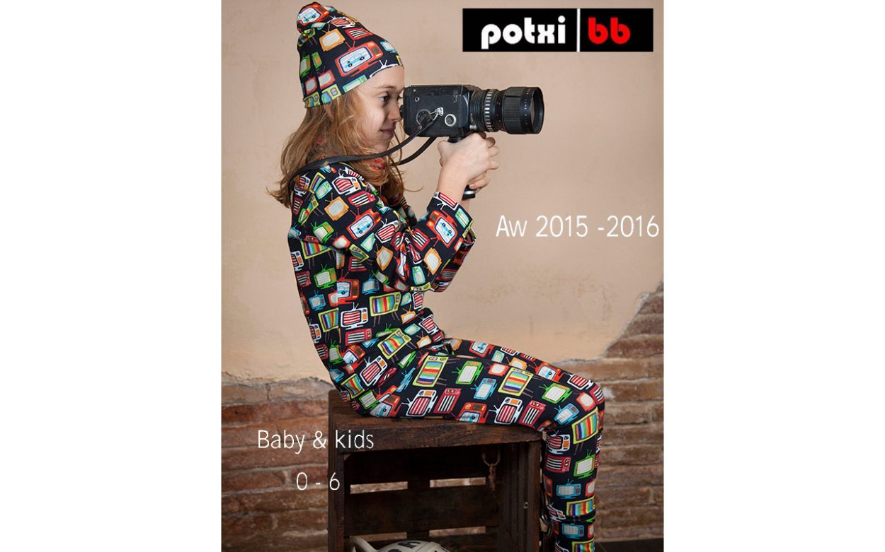 Child with vintage camera studio portrait
