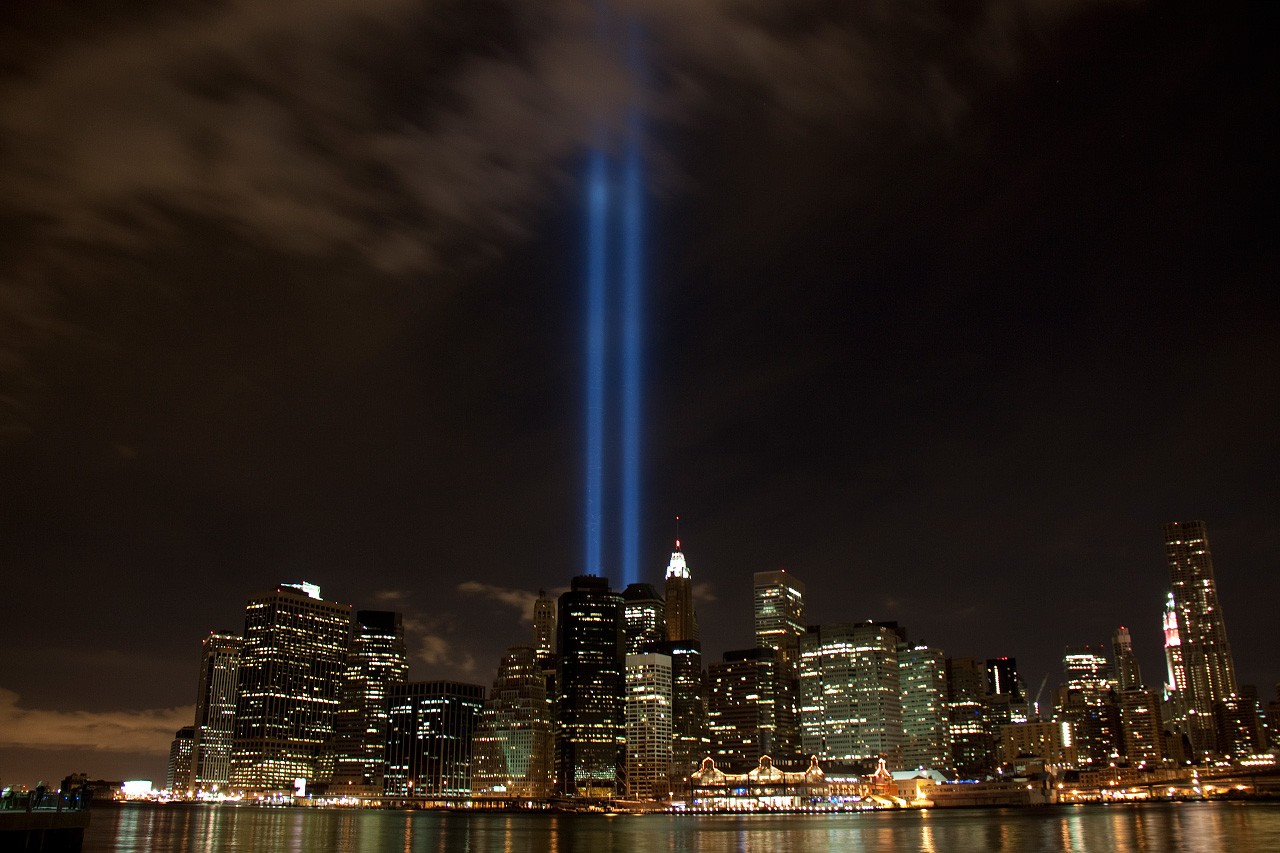 Tribute in Light beams over Lower Manhattan skyline at night