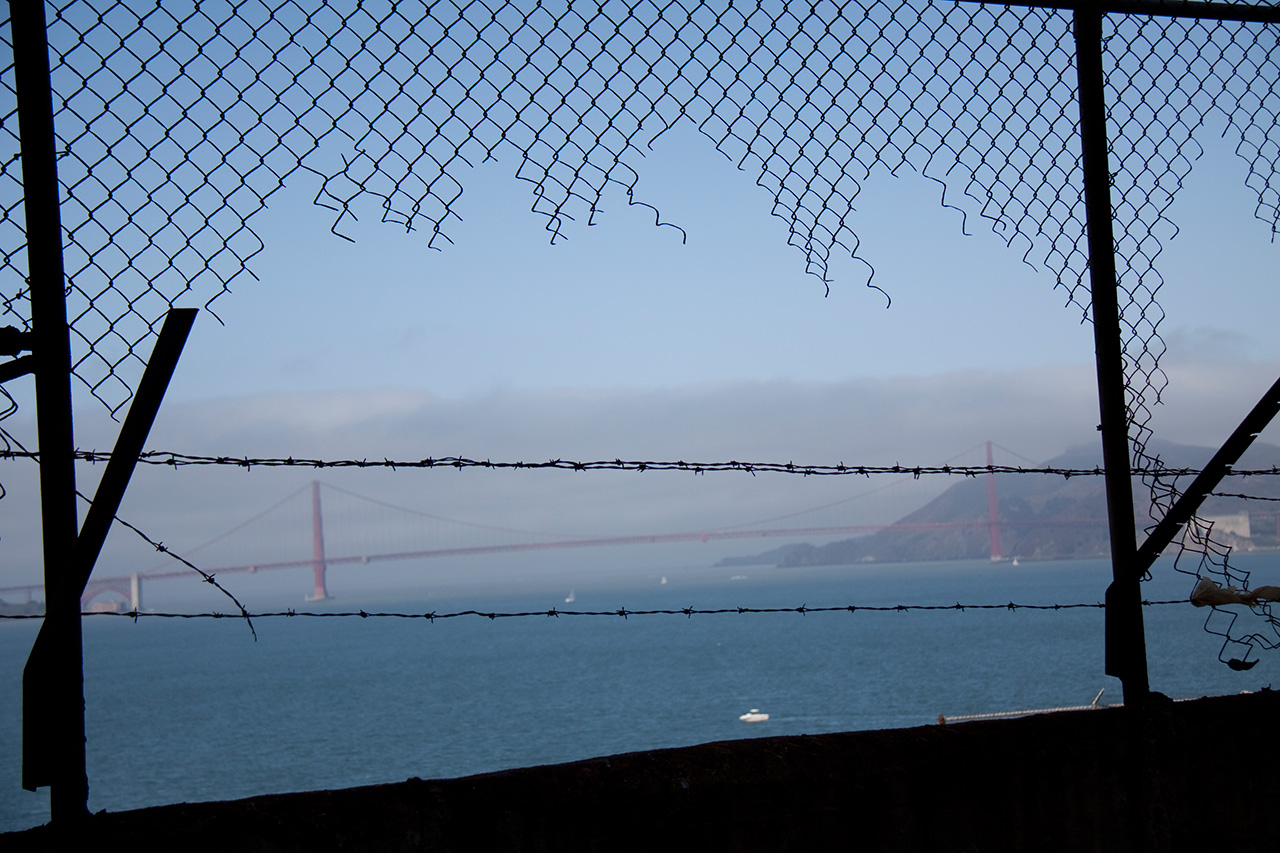 Golden Gate Bridge seen through barbed wire fence from Alcatraz
