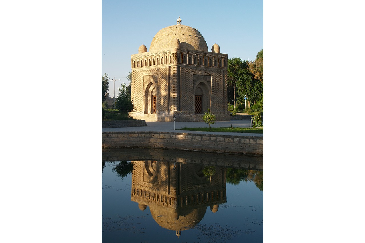 Ismail Samanid Mausoleum reflected in pond, Bukhara