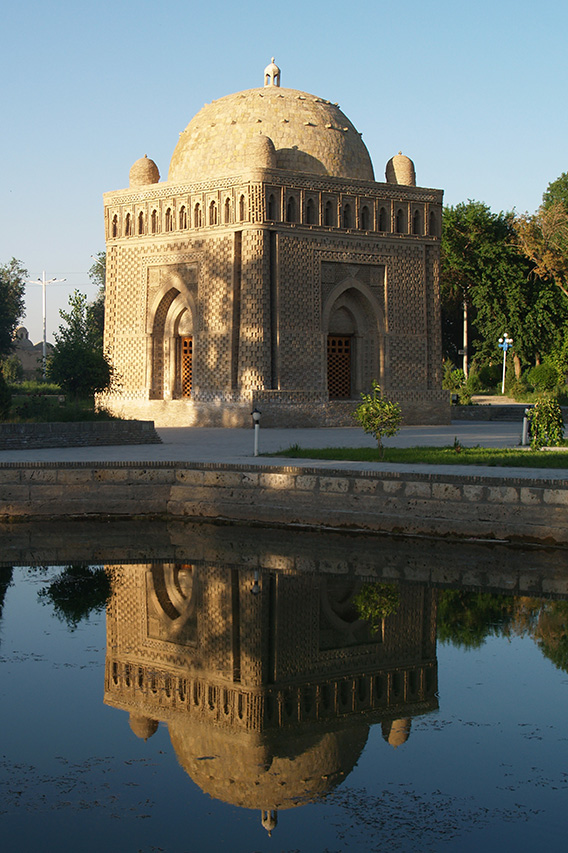 Ismail Samanid Mausoleum reflected in pond, Bukhara